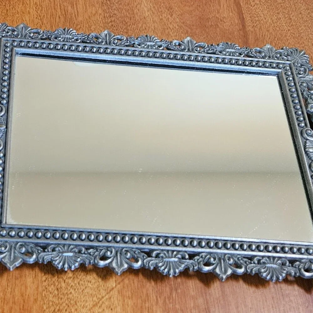 beautiful vintage ornate mirror has hook for hanging